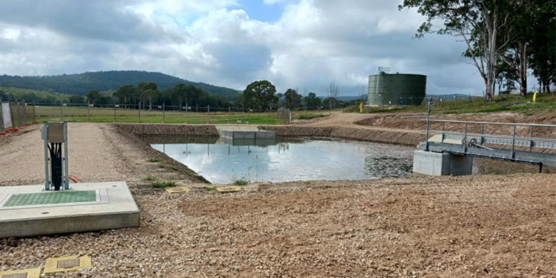 Urbenville water treatment plant in foreground, mountain and sky in background