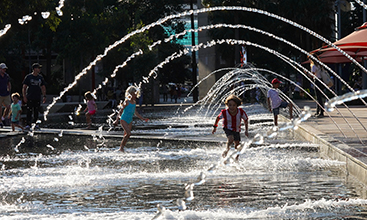 Children playing in the water at Darling Harbour, NSW. 