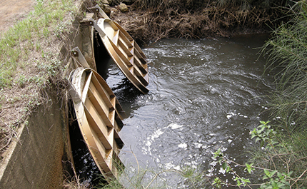 Moderate sized culverts with stainless steel floodgates.