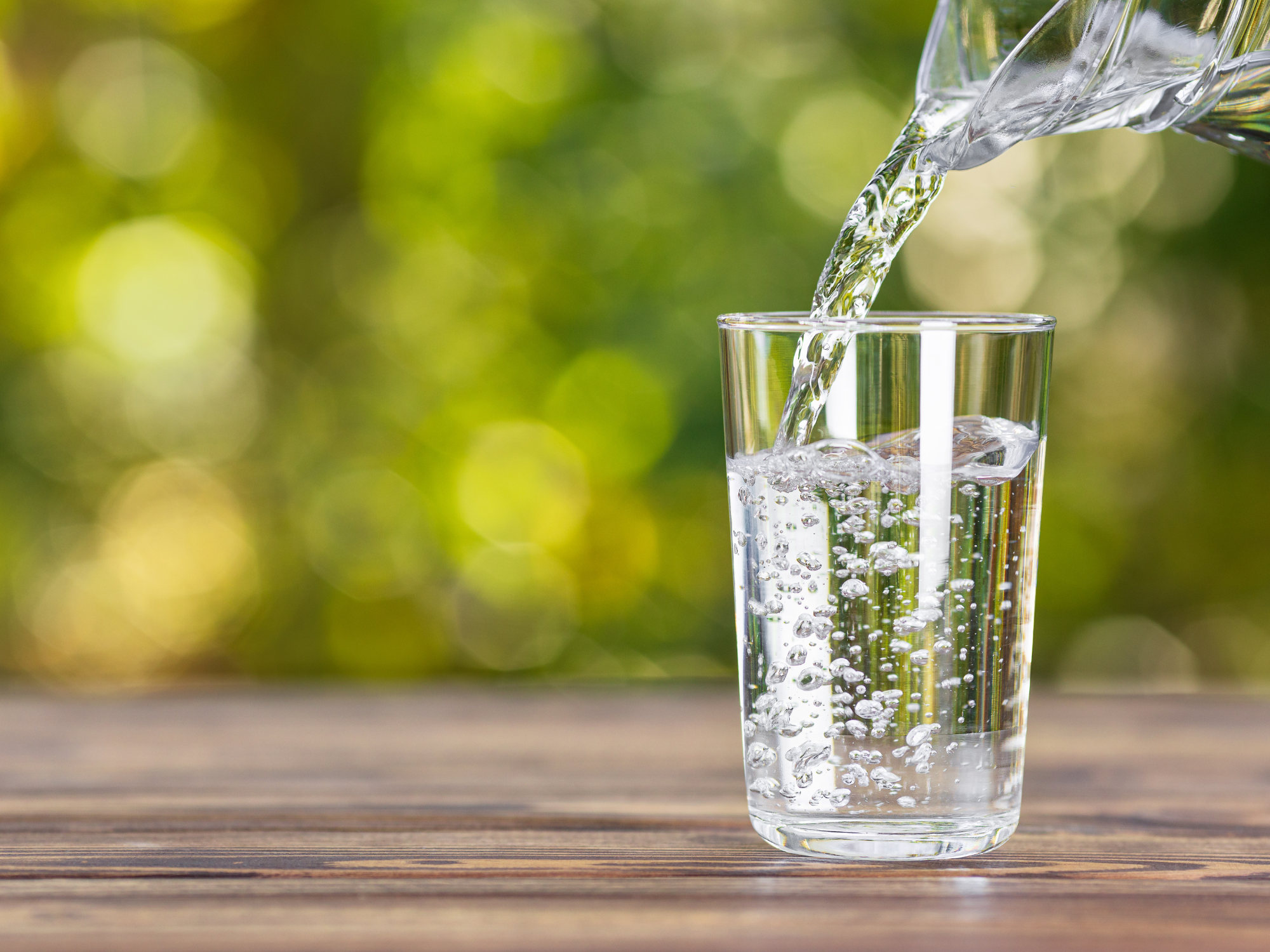 drinking water being poured into a glass